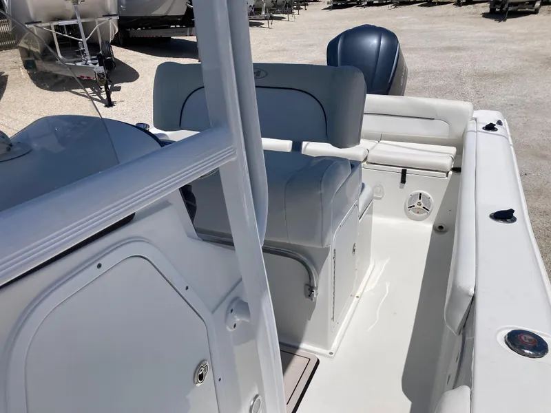 Slide: The Image of 2014 Sea Hunt 234 Ultra boat interior with seating and storage compartments. - 13