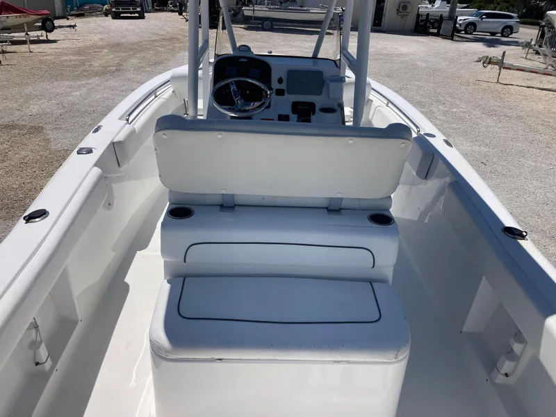 Slide: The Image of 2014 Sea Hunt 234 Ultra boat interior with seating and steering console. - 6