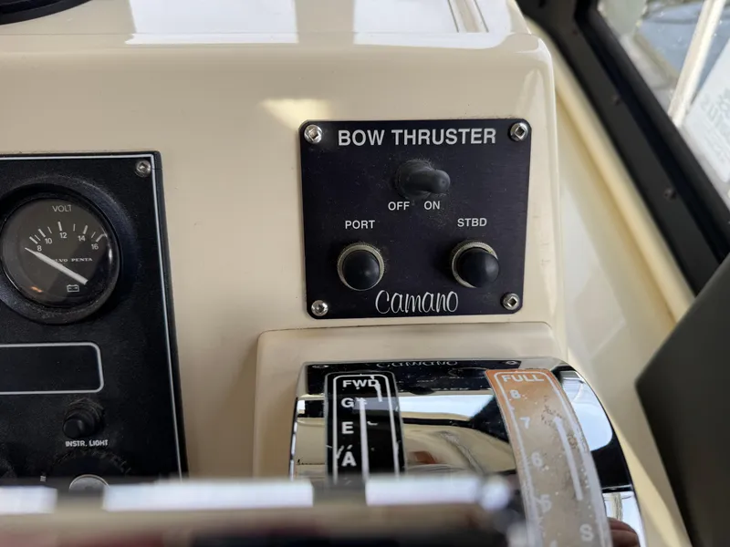 Slide: The Image of Control panel of a 2003 Camano Troll boat with bow thruster and throttle. - 13