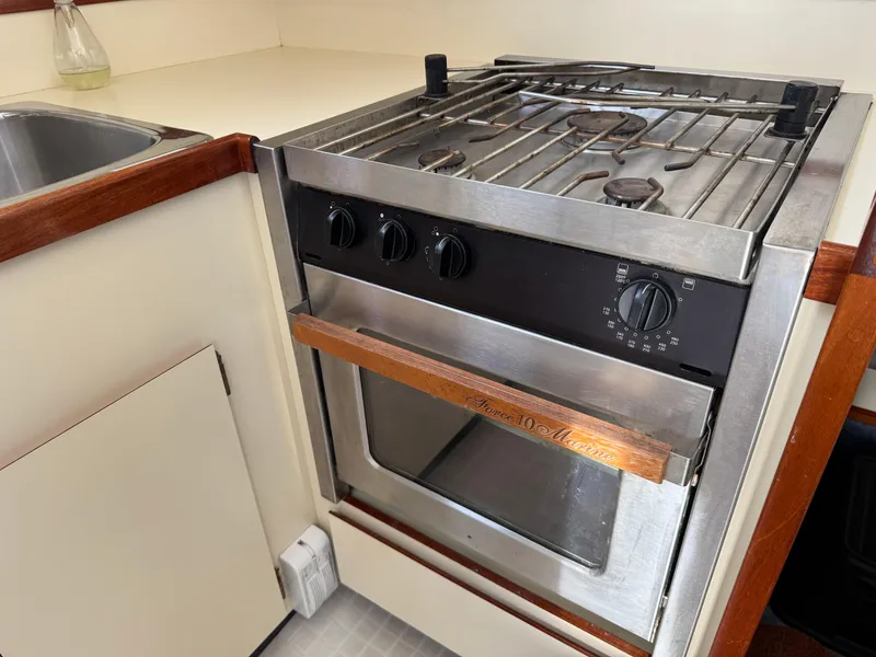 Slide: The Image of Stainless steel stove and oven in 2003 Camano Troll boat kitchen. - 26