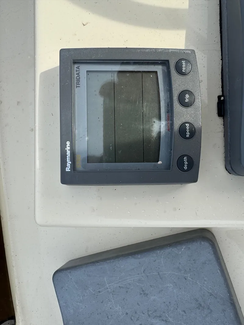 Slide: The Image of Raymarine Tridata display on 2003 Camano Troll boat dashboard. - 33
