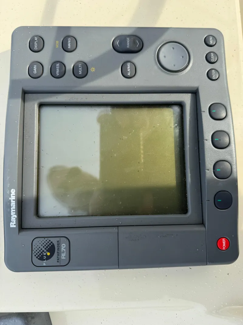 Slide: The Image of Raymarine navigation system on 2003 Camano Troll boat, featuring multiple control buttons. - 35