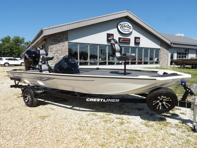 Slide: The Image of 2025 Crestliner XFC 189 boat on trailer outside dealership. - 1