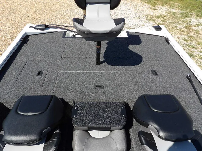 Slide: The Image of 2025 Crestliner XFC 189 boat interior with seating and carpeted deck. - 11