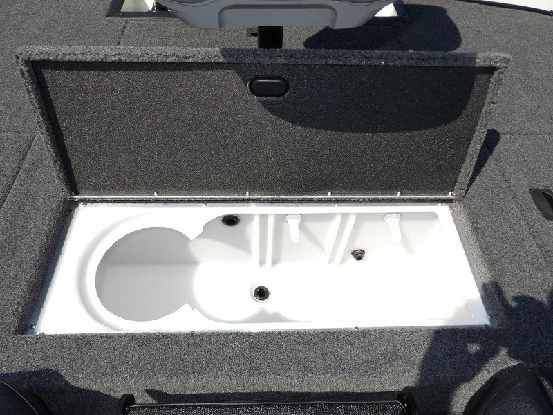 Slide: The Image of 2025 Crestliner XFC 189 boat storage compartment with open lid, showcasing interior design. - 14