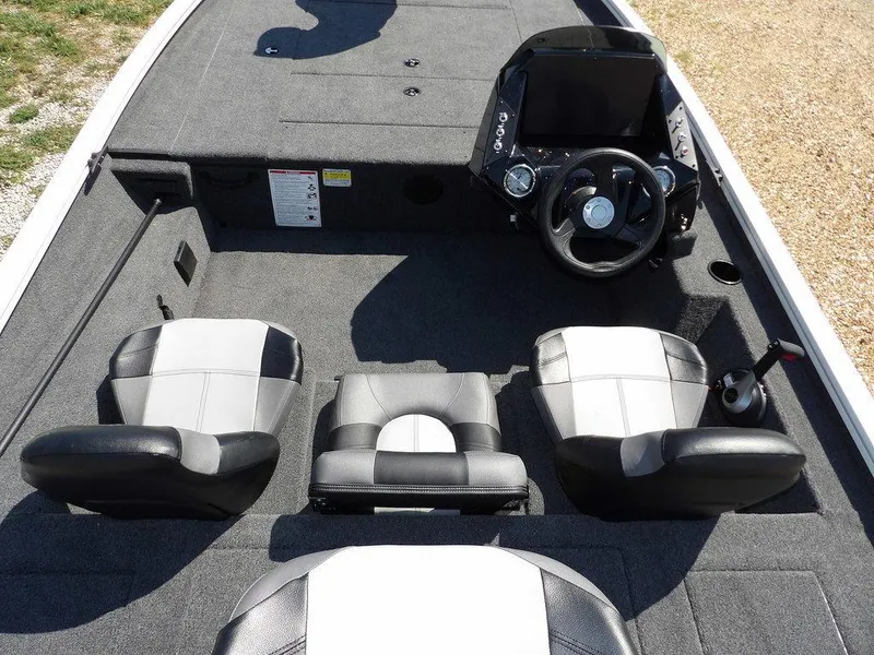 Slide: The Image of 2025 Crestliner XFC 189 boat interior with steering console and three seats. - 15