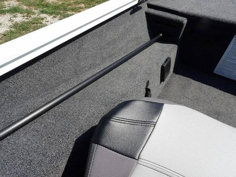 Slide: The Image of 2025 Crestliner XFC 189 interior with gray upholstery and rod holder. - 16