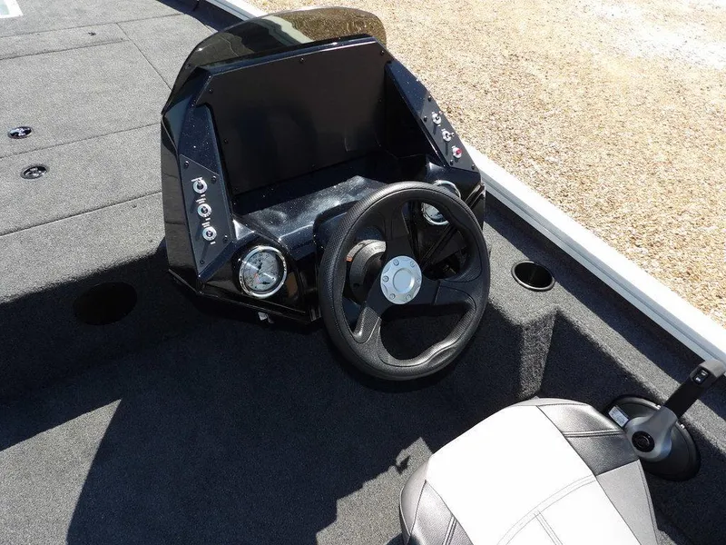 Slide: The Image of 2025 Crestliner XFC 189 boat console with steering wheel and seating. - 17
