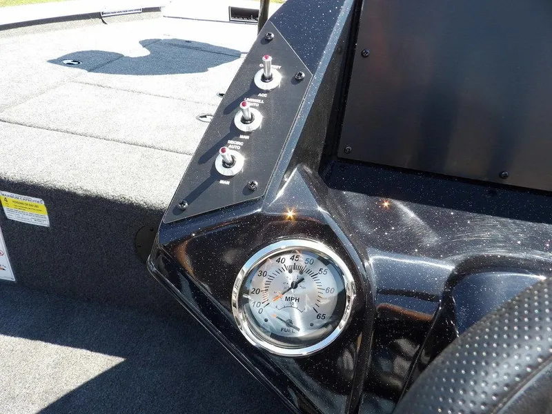 Slide: The Image of Dashboard of 2025 Crestliner XFC 189 boat with speedometer and control switches. - 19