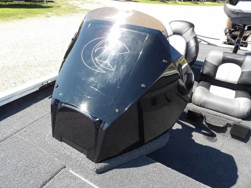 Slide: The Image of 2025 Crestliner XFC 189 boat console with sleek black design and comfortable seating. - 23