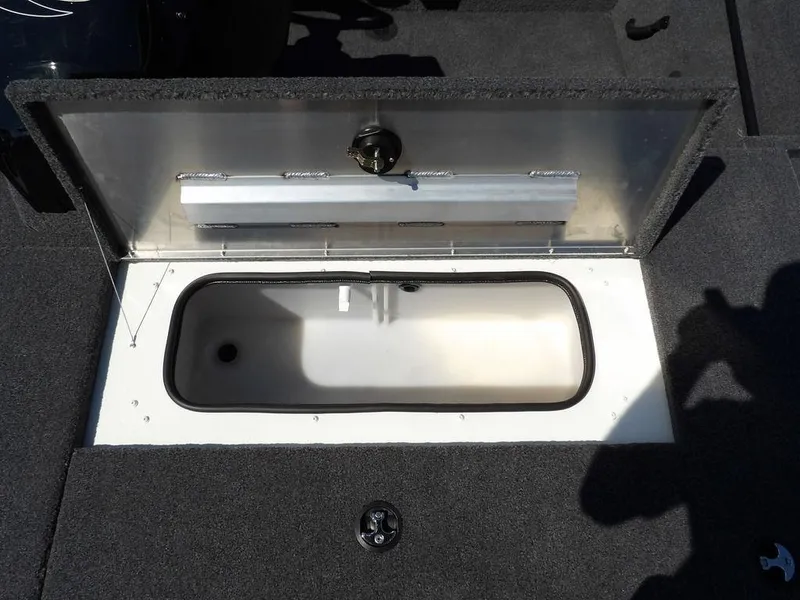 Slide: The Image of Open storage compartment in 2025 Crestliner XFC 189 boat, featuring a spacious interior. - 25