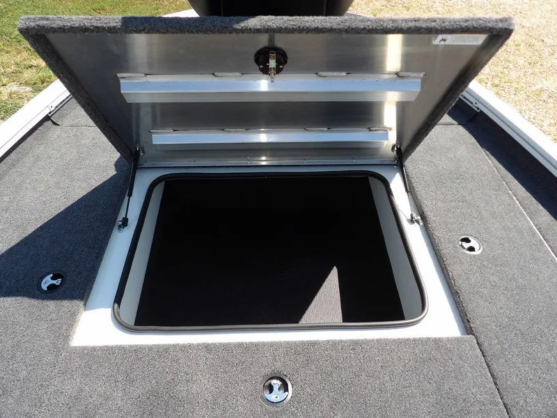 Slide: The Image of Open storage compartment on 2025 Crestliner XFC 189 boat deck. - 26