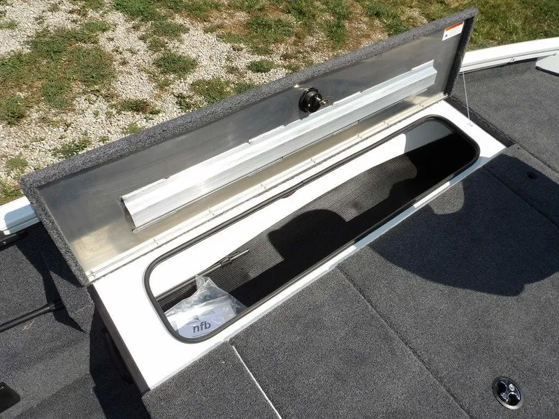Slide: The Image of Open storage compartment on 2025 Crestliner XFC 189 boat, showcasing interior space. - 28