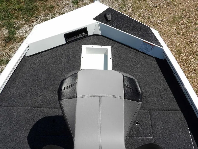 Slide: The Image of 2025 Crestliner XFC 189 boat interior with gray seating and black carpeted deck. - 29