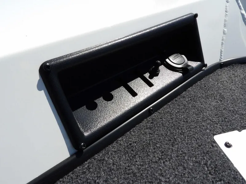 Slide: The Image of 2025 Crestliner XFC 189 boat interior with black storage compartment and carpeted flooring. - 31