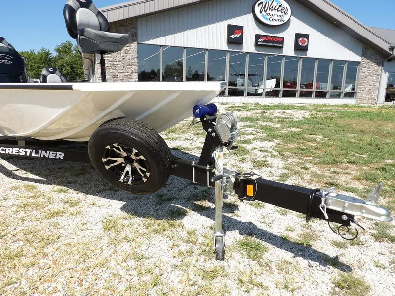 Slide: The Image of 2025 Crestliner XFC 189 boat on trailer outside dealership, showcasing modern design and features. - 33