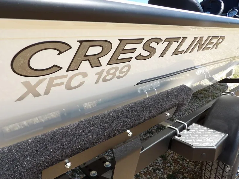 Slide: The Image of 2025 Crestliner XFC 189 boat side view with logo and trailer detail. - 37
