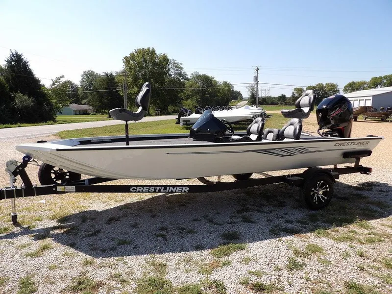 Slide: The Image of 2025 Crestliner XFC 189 fishing boat on trailer, parked outdoors. - 4