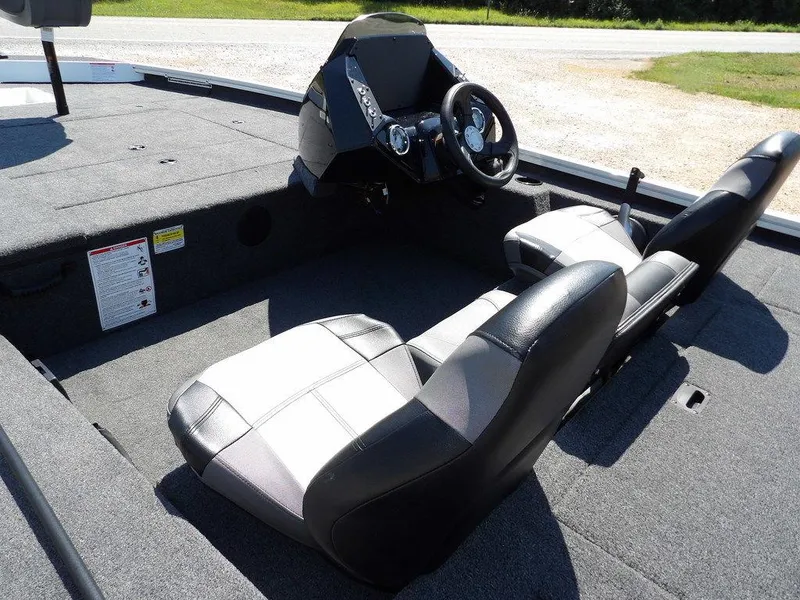 Slide: The Image of 2025 Crestliner XFC 189 boat interior with dual seats and steering console. - 8