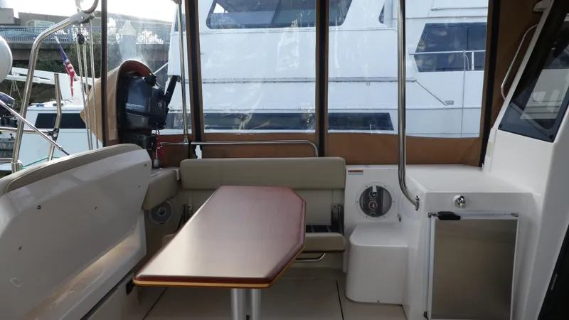 Slide: The Image of Interior of 2021 Ranger Tugs R-29 S with seating and table. - 15