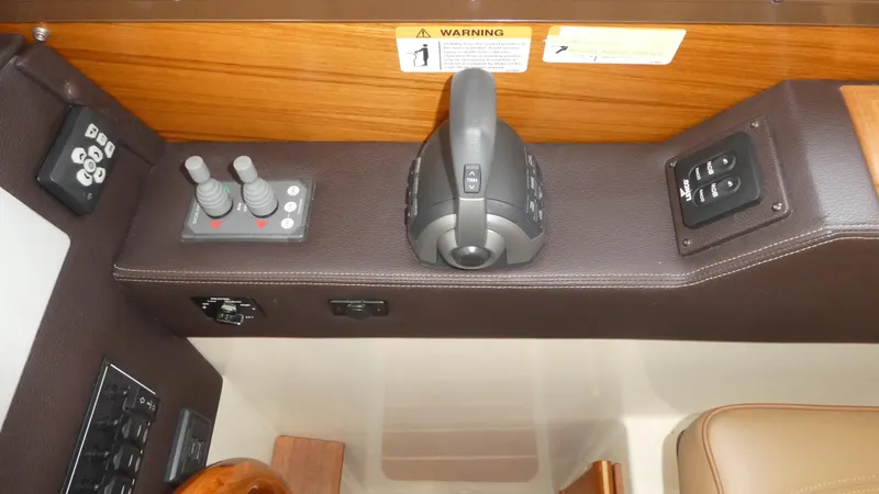 Slide: The Image of 2021 Ranger Tugs R-29 S helm controls with joystick and throttle. - 24