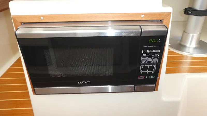 Slide: The Image of Built-in microwave in 2021 Ranger Tugs R-29 S boat kitchen area. - 27