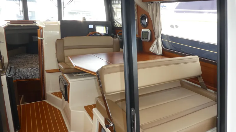 Slide: The Image of Interior of 2021 Ranger Tugs R-29 S with seating and dining area. - 31