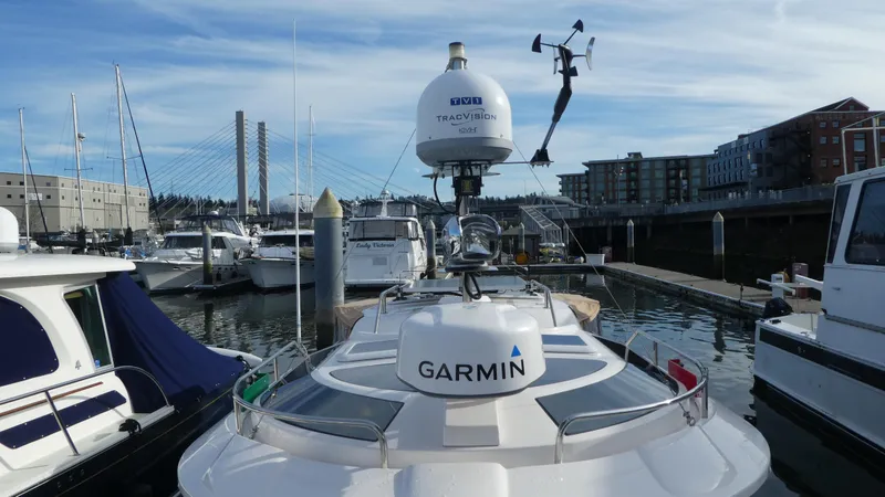 Slide: The Image of 2021 Ranger Tugs R-29 S docked, featuring Garmin navigation equipment. - 4