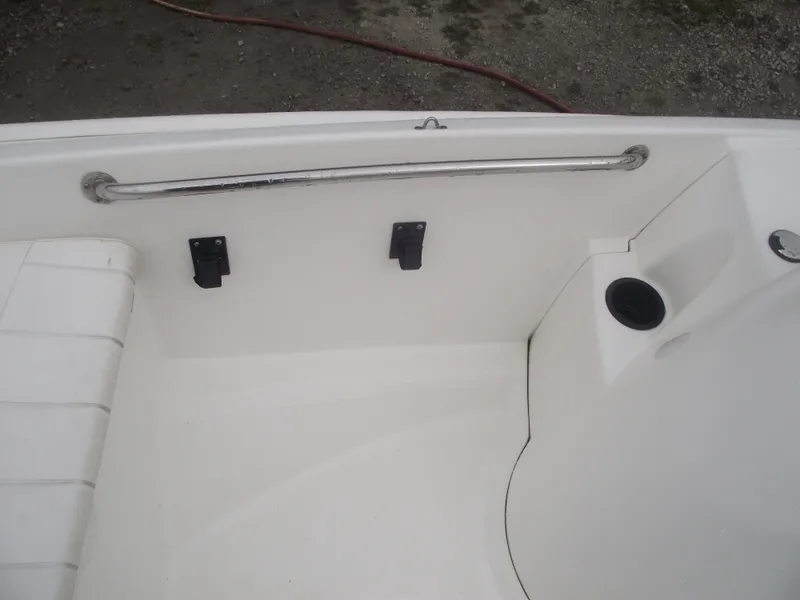 Slide: The Image of 2010 Boston Whaler 150 Super Sport interior detail with seating and railing. - 10