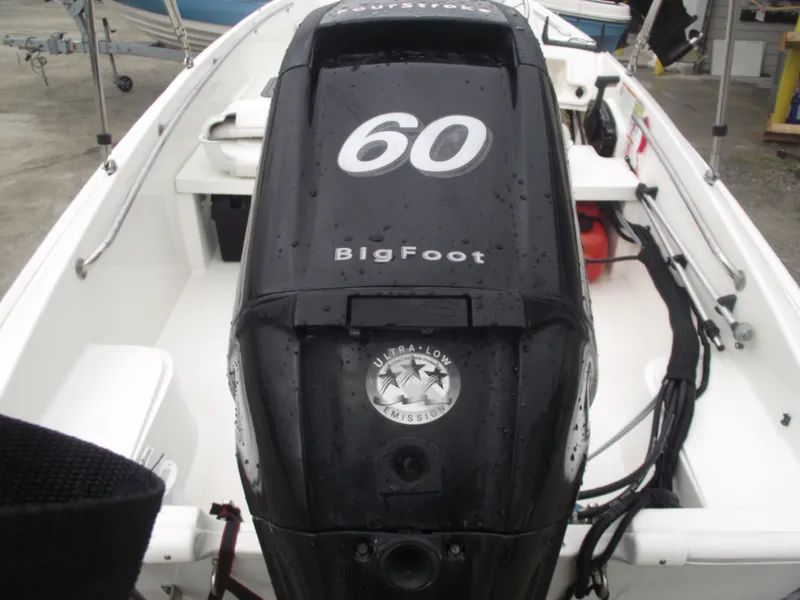 Slide: The Image of 2010 Boston Whaler 150 Super Sport with 60 HP BigFoot engine, rear view. - 4