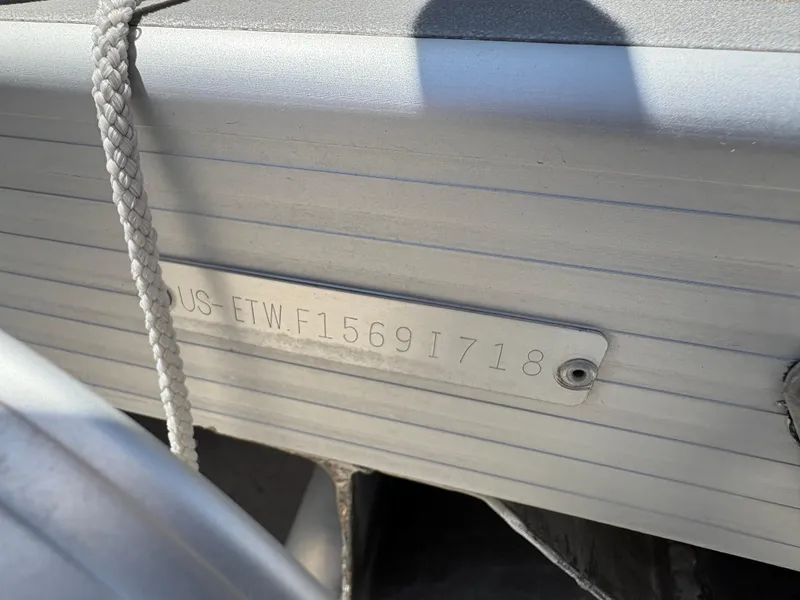Slide: The Image of 2018 Bennington 22 SSRX boat hull identification number plate with rope detail. - 13