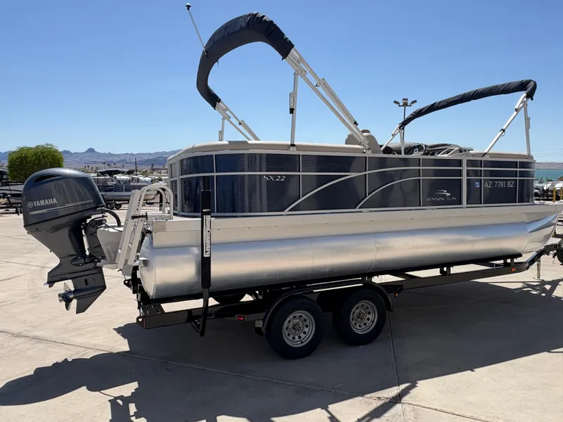 Slide: The Image of 2018 Bennington 22 SSRX pontoon boat on trailer with Yamaha outboard motor. - 3