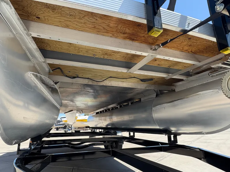 Slide: The Image of Underneath view of a 2018 Bennington 22 SSRX pontoon boat on a trailer. - 5