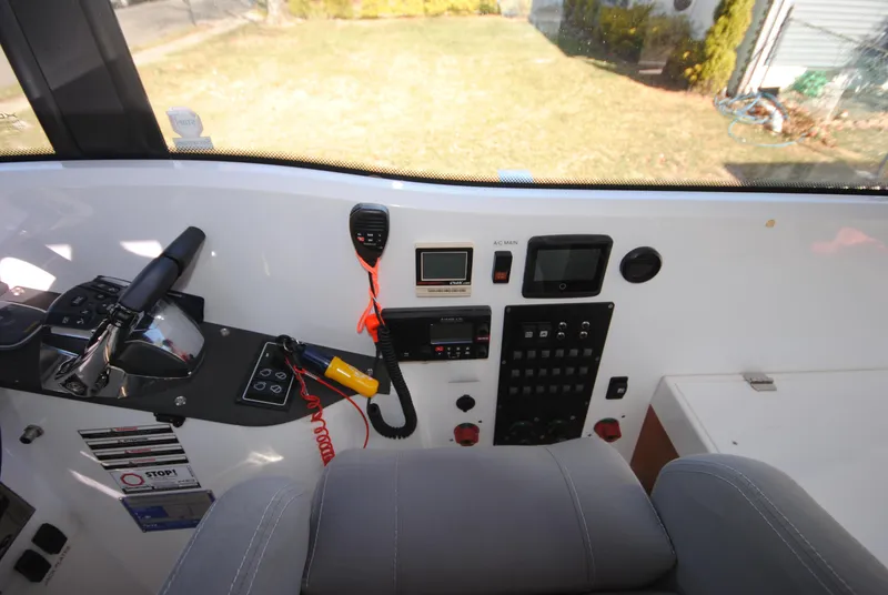 Slide: The Image of Interior cockpit of 2015 XO Boats 270 RS with control panel and navigation equipment. - 15