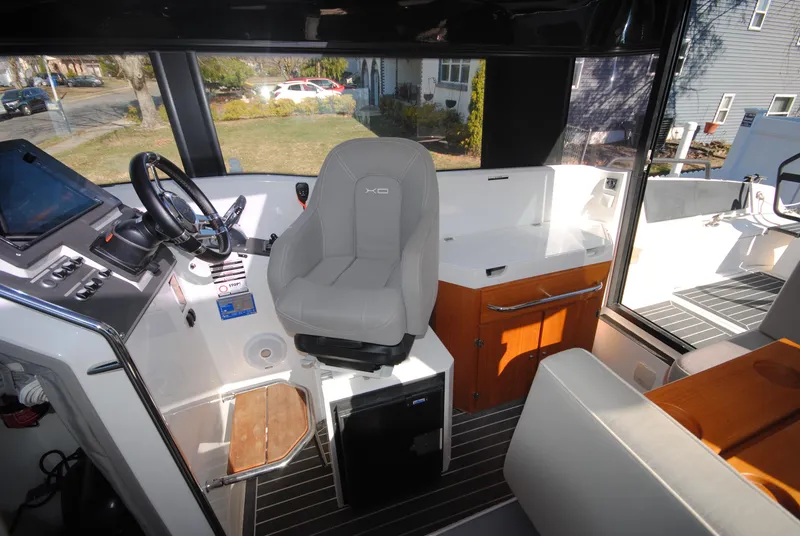 Slide: The Image of Interior of 2015 XO Boats 270 RS, featuring helm, seating, and storage. - 20
