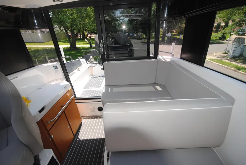 Slide: The Image of Interior of 2015 XO Boats 270 RS, featuring sleek seating and modern design elements. - 21