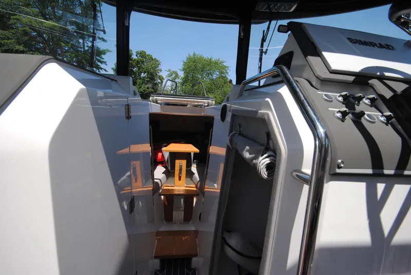 Slide: The Image of 2015 XO Boats 270 RS interior with modern controls and seating. - 24