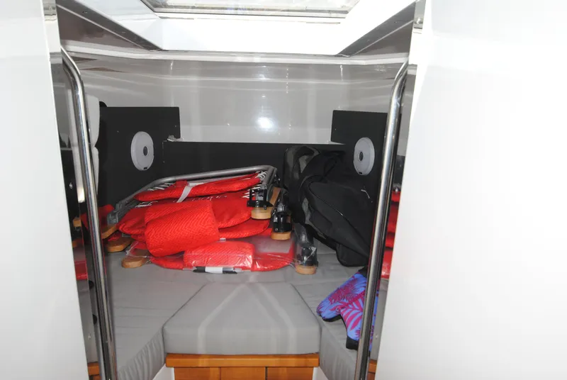 Slide: The Image of Interior cabin of 2015 XO Boats 270 RS with life jackets and storage. - 26