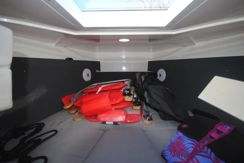 Slide: The Image of Interior cabin of 2015 XO Boats 270 RS with life jackets and gear. - 29