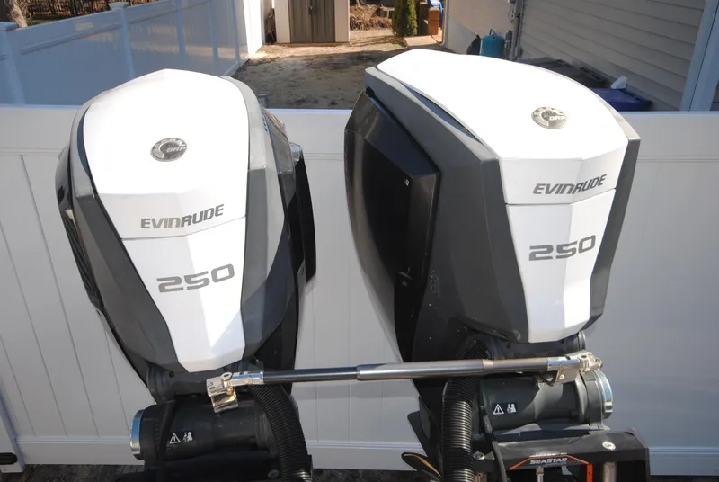Slide: The Image of Twin Evinrude 250 outboard engines on a 2015 XO Boats 270 RS. - 7