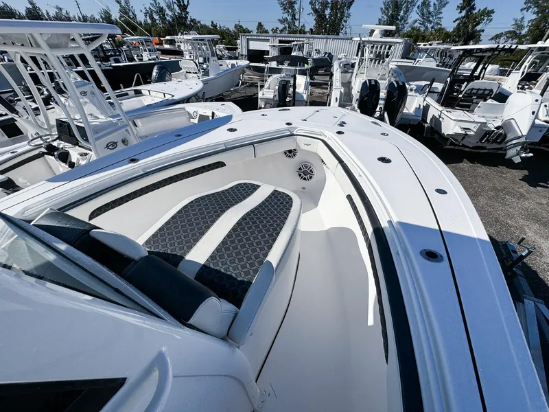 Slide: The Image of 2023 Tidewater 282cc Adventure Bluewater boat, featuring spacious seating and sleek design. - 24