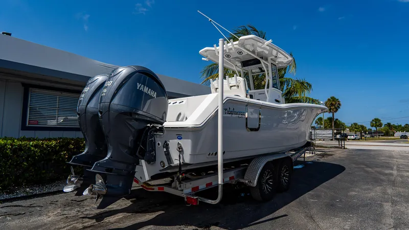 Slide: The Image of 2023 Tidewater 282cc Adventure Bluewater boat with Yamaha engines on a trailer. - 3