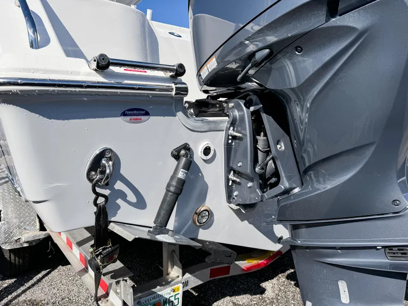 Slide: The Image of 2023 Tidewater 282cc Adventure Bluewater boat engine and trailer detail. - 5