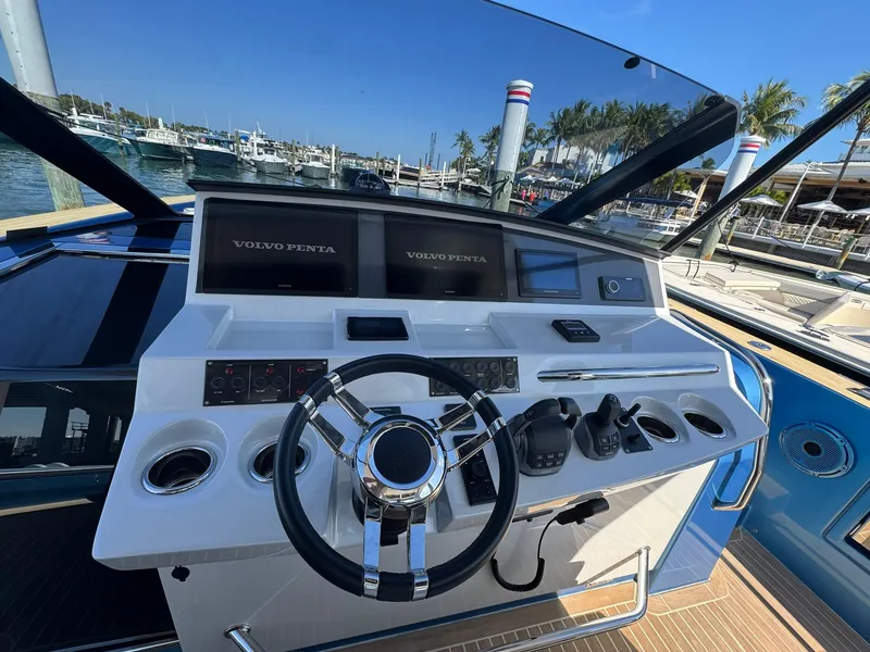 Slide: The Image of Helm of 2022 Pardo Yachts 43 with modern controls and steering wheel. - 13