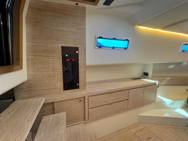 Slide: The Image of Interior of 2022 Pardo Yachts 43, featuring modern wood cabinetry and sleek design elements. - 18