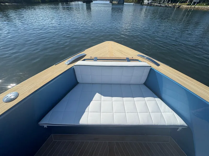 Slide: The Image of Pardo Yachts 43 (2022) bow with cushioned seating, on calm water. - 25