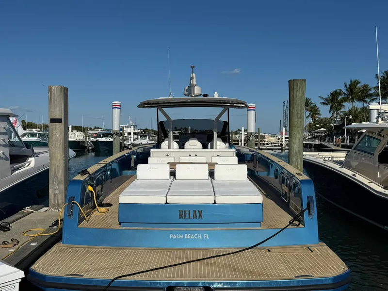 Slide: The Image of 2022 Pardo Yachts 43 docked in Palm Beach marina, featuring spacious deck and seating. - 4