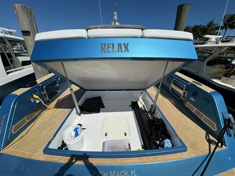 Slide: The Image of 2022 Pardo Yachts 43 in Palm Beach, FL, with open storage and "RELAX" on the back. - 5