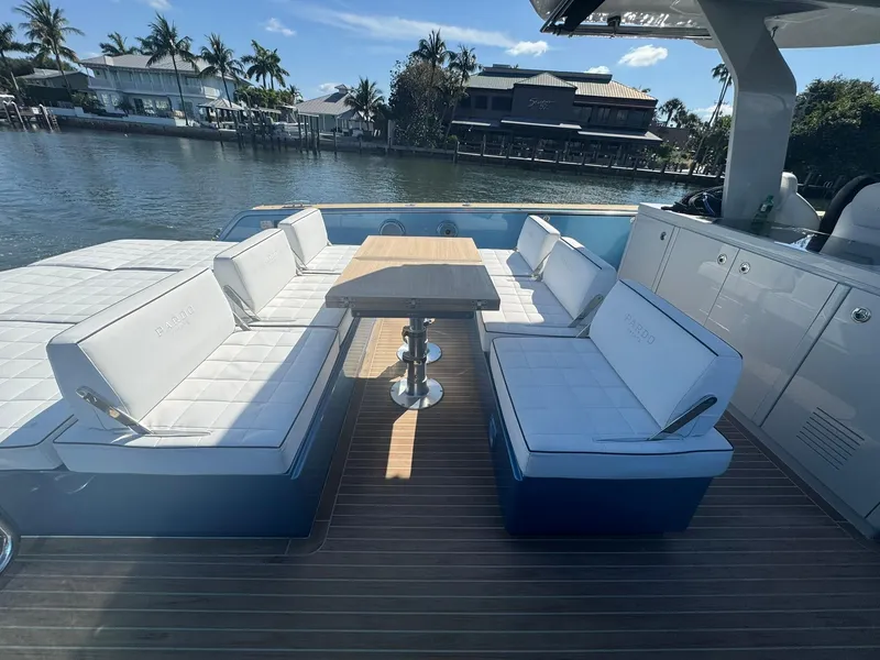 Slide: The Image of Luxurious seating area on 2022 Pardo Yachts 43, featuring elegant white cushions and wooden table. - 8