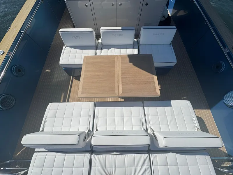 Slide: The Image of Luxurious seating area on 2022 Pardo Yachts 43 with elegant wooden table. - 9